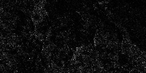 Grungy black surface with numerous white crack and scratches and dust particles distressed background. abstract chalk rubbed out on blackboard for background. dirty grunge texture vector. black paper.