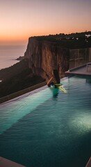 Infinity pool sunset woman cliffside luxury travel vacation relaxation scenic view beautiful horizon