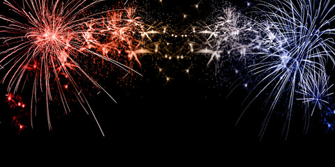 Fireworks sparklers and red white and blue American flag colors on dark background. July 4th...