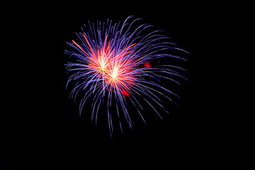 Fireworks sparklers blue and red colors on dark background. July 4th Independence Day, Memorial Day...