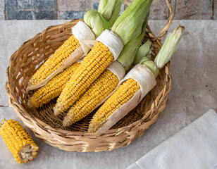 Freshly harvested corn on the cob in a rustic setting