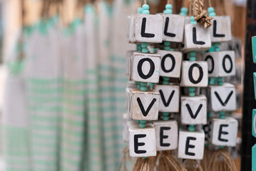 Handmade bracelets and necklaces with the word LOVE