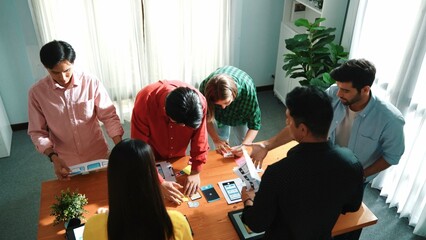 Top view of skilled Ui designer brainstorming by writing on sticky notes and planning about Ux Uo...