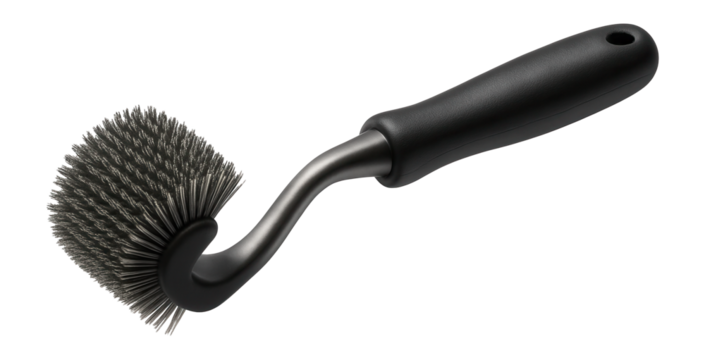 Grill cleaning brush with a flexible head, adept at conforming to the curves of a kettle grill in a backyard.