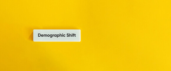Demographic Shift Concept on Minimal Yellow Background with Letter Tile