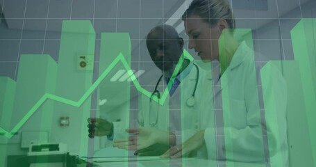 Two doctors placing on scanner and analyzing healthcare data while green bars and line graph moving - Powered by Adobe