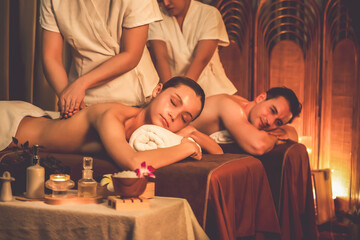 Caucasian couple customer enjoying relaxing anti-stress spa massage and pampering with beauty skin...