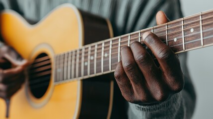 Obraz premium Capturing the intricate movements of a musician's hands skillfully playing chords on an acoustic guitar, evoking a soulful bluesy melody
