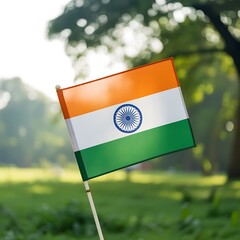 An indian flag waving in the wind against a blurred natural background