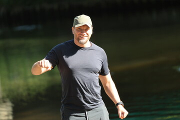 Man smiling in a natural environment