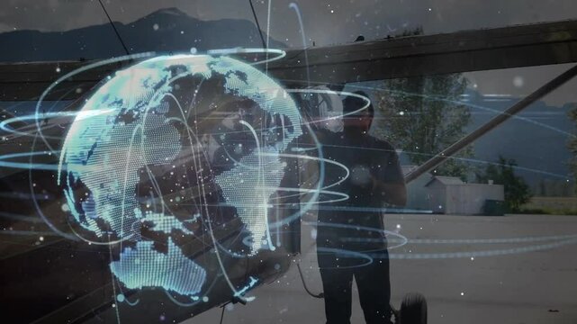 Pilot connecting ground-power cable wing strut activating globe hologram rotating for system check