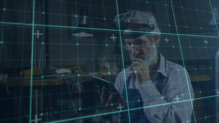 Senior technician adjusting MR headset and tapping tablet, rendering grid for aligning overlay - Powered by Adobe