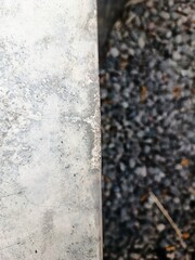 Juxtaposition of Smooth Concrete and Rough Gravel Texture