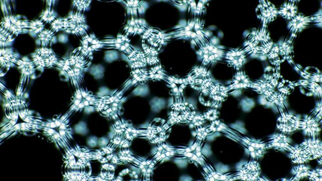 Abstract honeycomb pattern on a dark background, connected shapes