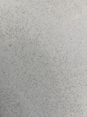 Fototapeta premium Closeup of rough gray cement wall texture, useful for backgrounds or material references.