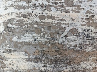 Old concrete wall texture with peeling paint and weathered surface, perfect for grunge design, vintage background, and architectural details