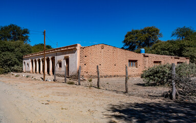 Old, traditional adobe house under clear blue sky in Valle de Luracatao, Salta, Argentina. Rustic...