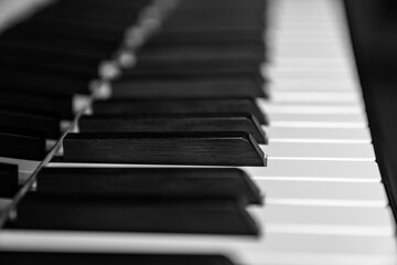 Close up of piano keys in black and white, abstract musical background for classical, jazz, and modern compositions, perfect for music education, concert promotion, and creative design projects.
