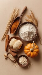 Autumn Baking Ingredients Flatlay: Pumpkin, Dough, and Wheat on Beige Background.