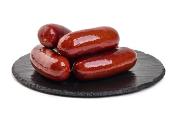 Smoked Sausages on Slate plate, isolated on white background