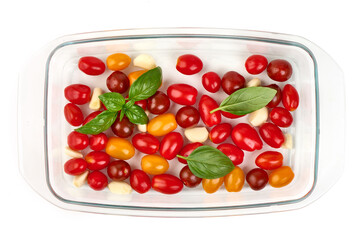 Cherry Tomatoes with Basil and Garlic in Baking Dish, top view