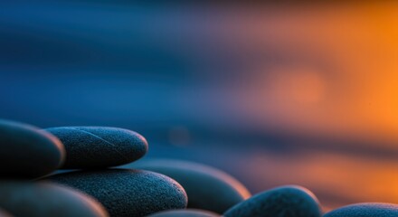 Tranquil Stones on a Beach at Sunset with Colorful Background