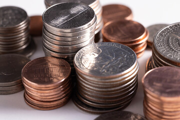 A stack of dollar coins stacked on each other in different positions. Money