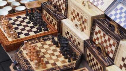 Many Chess boards sold in a market © Ruud