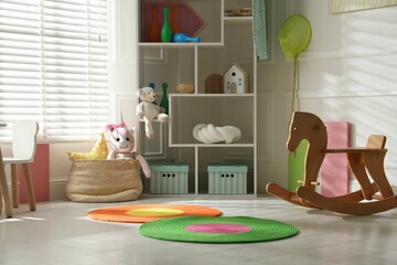 Stylish playroom with toys and furniture. Interior design