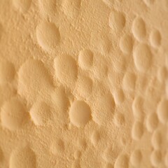 Close up macro view of a textured beige surface with small raised bumps
