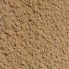 Close up textured background of rough sandy gravel aggregate material