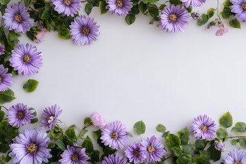 Elegant top view floral arrangement with purple daisies and green leaves