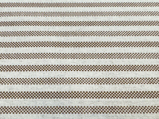 Textured white and brown striped fabric pattern close-up