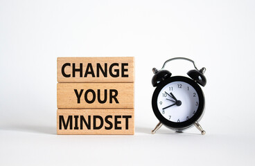 Change your mindset symbol. Concept words Change your mindset on wooden blocks with alarm clock....