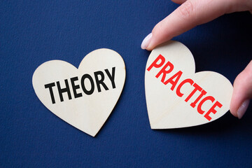 Theory or Practice symbol. Concept word Theory or Practice on wooden hearts. Businessman hand....