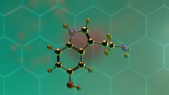 3D animation of a serotonin molecule rotating on a soft hexagonal patterned background with turquoise and green tones. The molecular structure shows detailed carbon, hydrogen, nitrogen, and oxygen ato