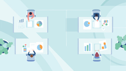 Aerial view of office space with four people working at desks with charts and graphs on display around them