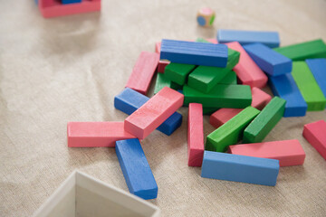 Colorful wooden blocks stacked on a surface. Playful objects to help develop children's fine motor...