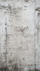 Full frame shot of a concrete wall highlighting its rough texture, imperfections, and variations in gray tones, suitable for backgrounds and textures