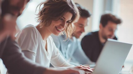 Laptop & Collaboration: A team of professionals collaborating on a laptop, emphasizing the unity of teamwork and synergy within a modern workspace, radiating success and achievement.