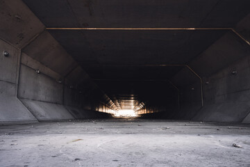 Focus stacked image inside a concrete box culvert under a road for stormwater drainage. 