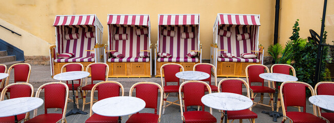 Striped Beach Chairs and Bistro Tables in Outdoor Setting