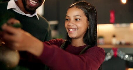 Decorating, Christmas tree and child with dad, home or smile for ornament on holiday, night or event. Happy, man and bonding with daughter for celebration, festive season or family tradition in house