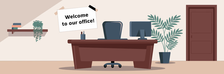 Cozy office setup with welcome note, desk, and potted plant