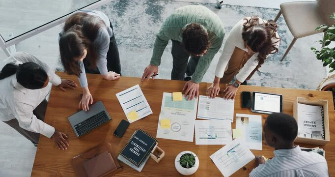 Business, finance and people brainstorming with paperwork for annual report, forecasting or growth. Above, teamwork and planning with invoice sheet for company performance and budget review in office