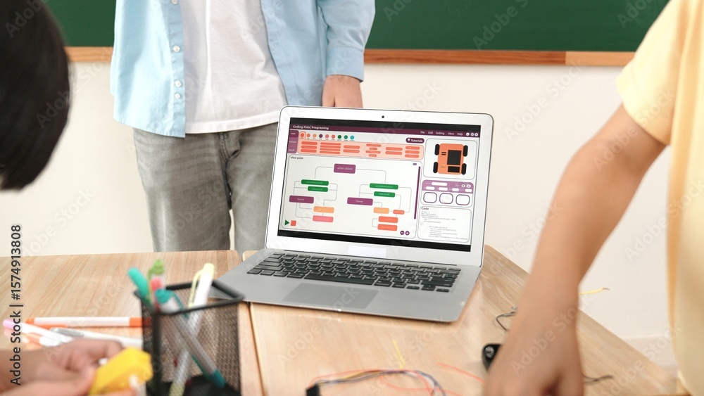 Poster group of diverse student working together on main board with laptop screen display engineering promp