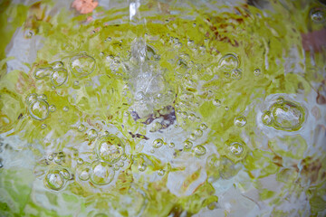 Close up of a fountain with springing water and air bubbles