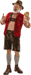 Happy senior man in traditional Bavarian costume with pretzel and showing thumbs up isolated on...