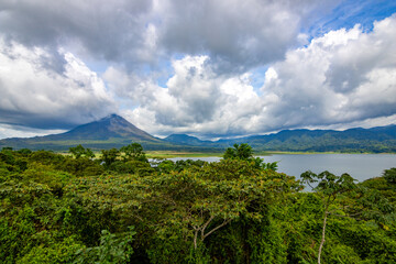 Fototapeta premium Panoramic view of Arenal Volcano National Park in Costa Rica, with the volcano and Arenal Lagoon in the background