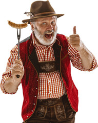 Cheerful senior man in traditional Bavarian costume holding sausage on fork giving thumbs up....